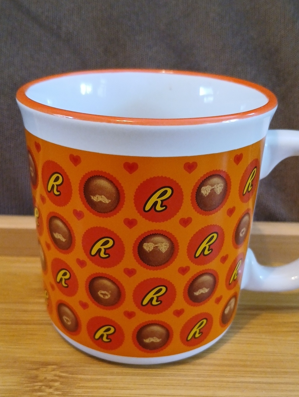 Bright Orange Ceramic Mug with Playful 'R' Motiff